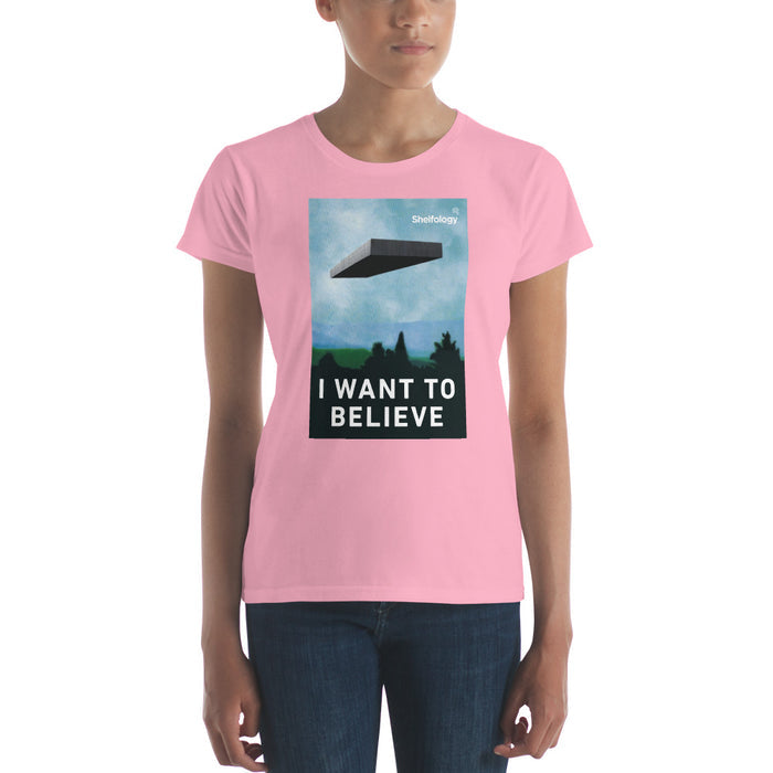 Women's Believe T-shirt in soft pink with graphic of a floating shelf and "I WANT TO BELIEVE" text by Shelfology