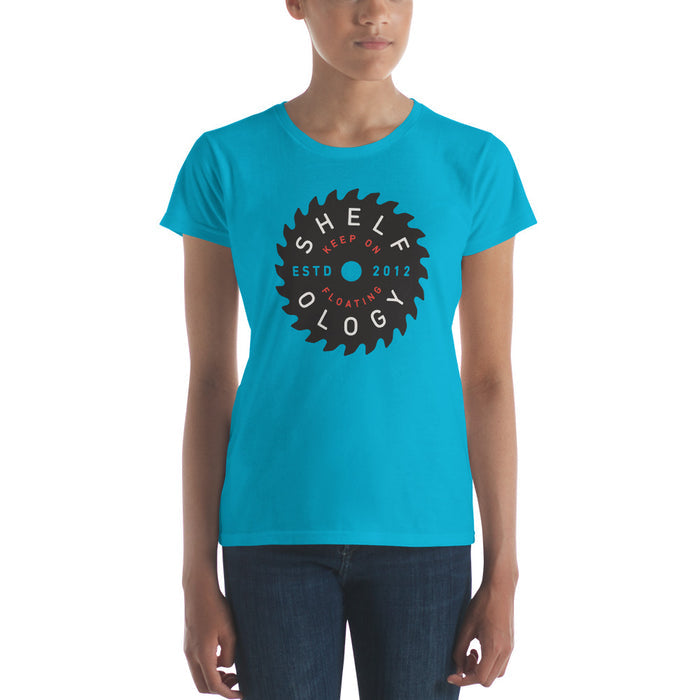 Women's Rough Sawn T-shirt in vibrant Caribbean blue featuring a circular saw blade graphic with Shelfology branding