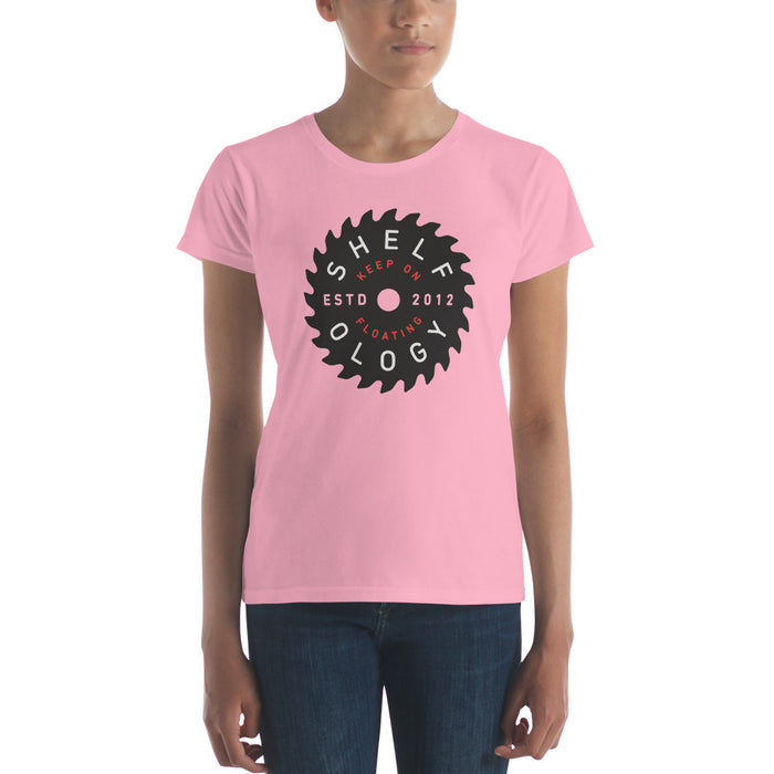 Women's Rough Sawn T-shirt in soft pink with bold circular saw blade graphic showcasing Shelfology branding for casual wear