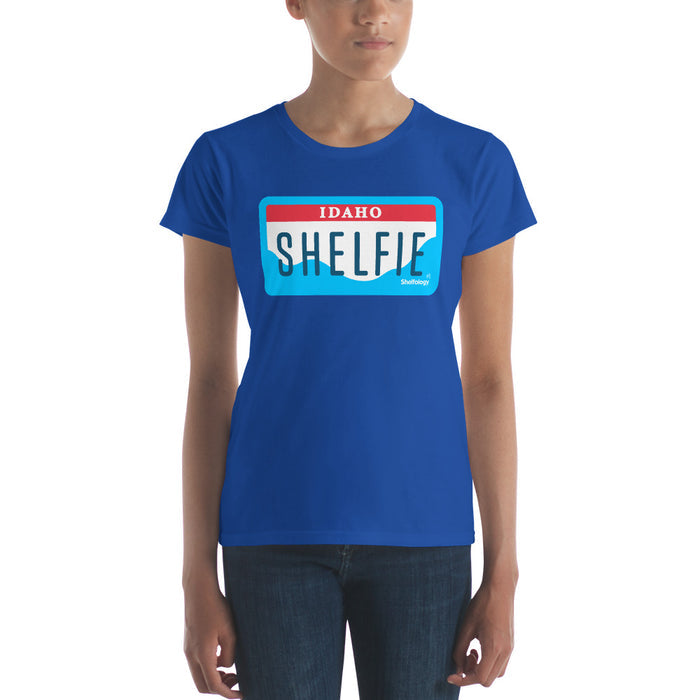 Women's Shelfie T-shirt in bright blue featuring a stylized Idaho license plate graphic for casual wear