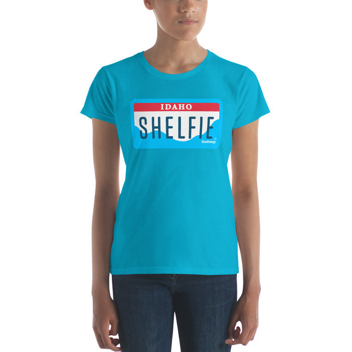 Women's Shelfie T-shirt in bright Caribbean blue with Idaho license plate graphic for casual everyday wear