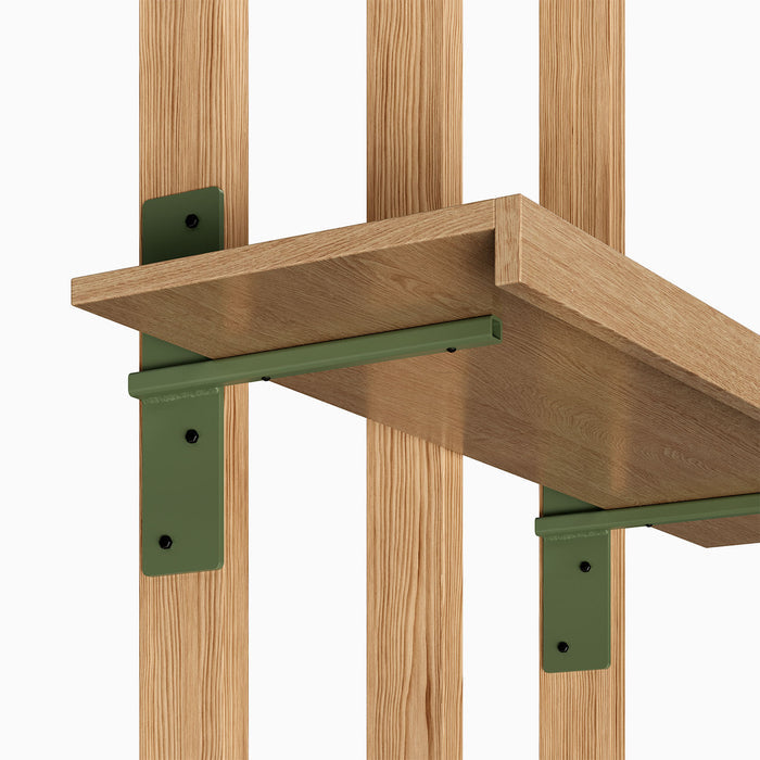 Yuri MD Floating Desk Bracket (Powder Coated) in olive green metal supporting wood floating shelf on vertical wood slats